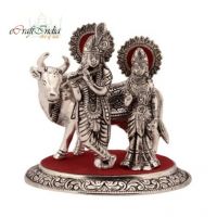 eCraftIndia Silver And Red Radha Krishna Statue With Cow