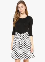 The Vanca Flared Dress In Black Color With A Polka Printed Bottom And Waist Belt-3/4Th Sleeves