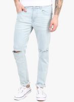 Incult Tapered Jeans In Light Wash With Knee Rips