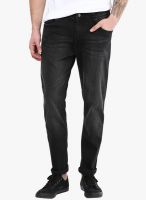 Incult Tapered Jeans In Washed Black