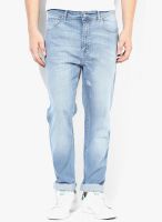 Incult Tapered Jeans In Light Wash With Rips