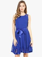 The Vanca Lace Overlay Flared Dress In Blue Color With A Waist Belt-Sleeveless