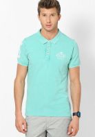 United Colors of Benetton Green Solid Polo T-Shirts